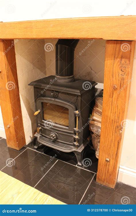 Small Wood Burning Stove With Wooden Beam Enclosure Stock Photo Image