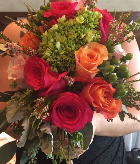 Bouquet Of Pink Hot Pink And Orange Roses With Hints Of Greens