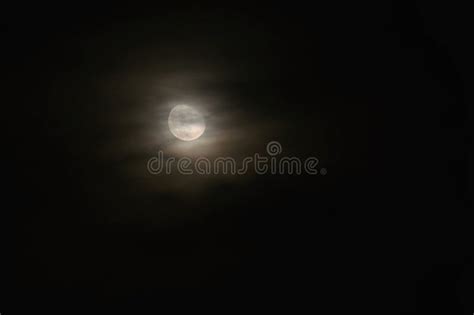 Full Moon Over Dark Black Sky At Night Mysterious Concept With Clouds