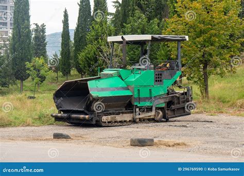 Asphalt Paver Machine. Asphalt Finisher or Paving Machine Placing a ...