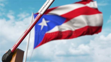 Opening Boom Barrier With QUARANTINE Sign Against The Puerto Rican Flag