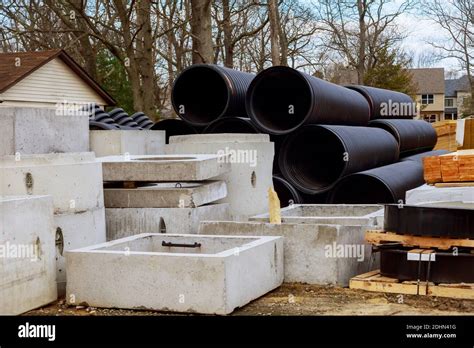 PVC Tubes Plastic Pipes Stacked In Rows At A Construction Site On