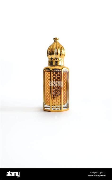 Arabian Oud Perfume In Mini Gold Bottle Isolated On White Background