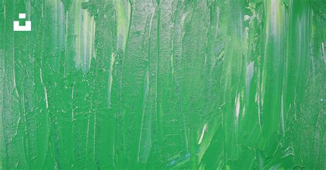 An abstract painting of green paint on a green background photo – Free Art Image on Unsplash