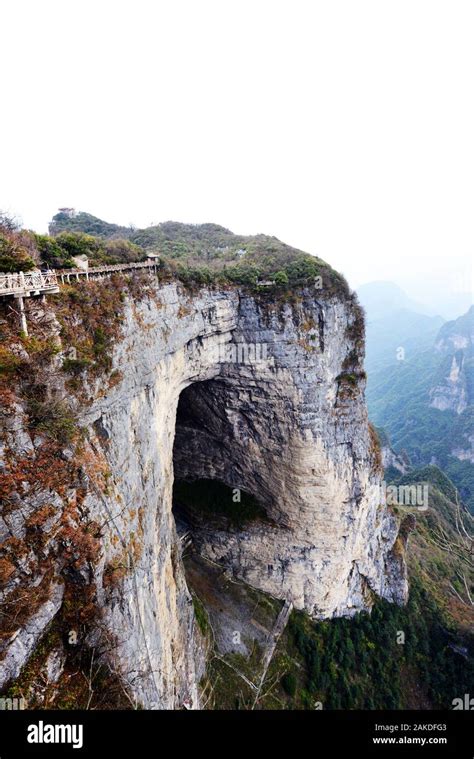 A view of the Heaven's Gate natural arch from the top of Tianmen mountain in Zhangjiajie, China ...