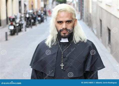 Priest With Blonde Dyed Hair Walking On The Street Stock Image Image