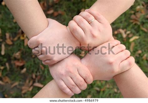 Four Hands Hold Each Other Stock Photo 4986979 Shutterstock