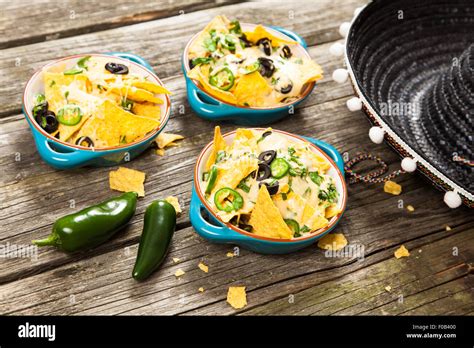 Nachos with melted cheese Stock Photo - Alamy