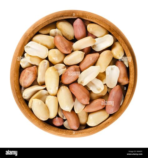 Shelled Peanuts In Wooden Bowl On White Background Dry Roasted Arachis