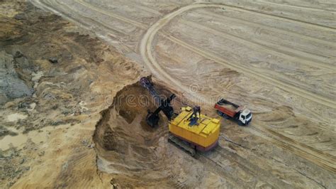 Excavator Load The Sand Into Dump Truck In Open Pit Mine Truck Transports Gravel From Quarry