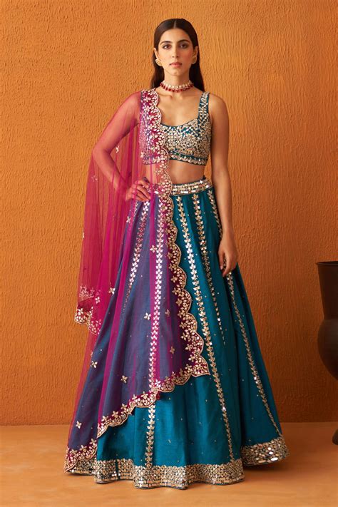 Buy Blue Raw Silk Embroidered Mirror Round Neck Zari And Lehenga Set For Women By Angad Singh