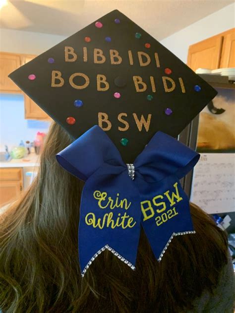 This Image Is Of A Black Graduation Cap With The Term Bibbidi Bobbidi