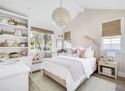 A Bedroom With Pink And White Decor In The Corner Along With Shelves