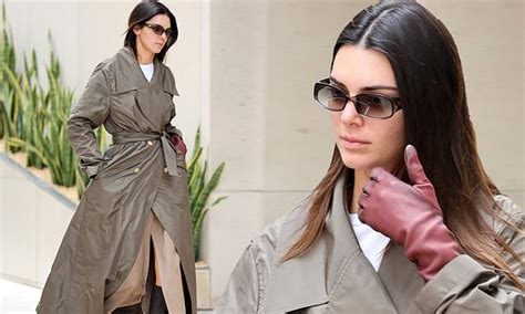 Kendall Jenner Pairs A Trench Coat With Boots As She Heads To Her 250k