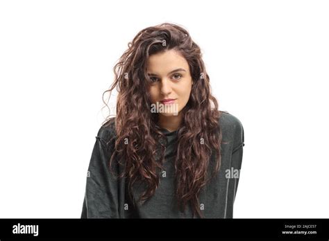 Portrait of a young woman with brown curly hair isolated on white ...