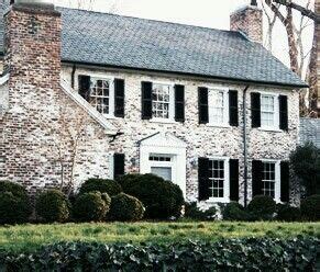 Classic Brick House with Black Shutters