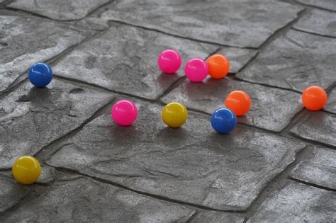 Premium Photo | Colorful balls on the concrete floor