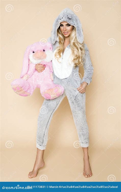 Beautiful Blonde Woman Wearing A Pajama A Bunny Costume Smiling