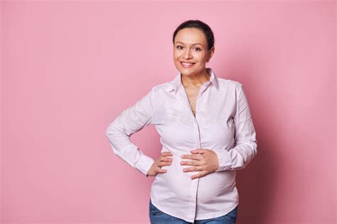 Attractive Middle Aged Pregnant Woman Touching Her Belly Smiling