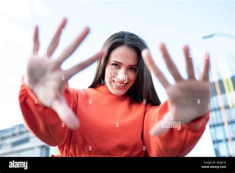 Portrait Of Beautiful Brunette Reaching Toward Camera Stock Photo Alamy