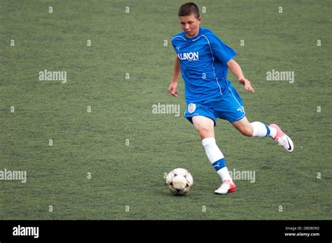 Teen Soccer Player Dribbling The Ball During A Game Stock Photo Alamy