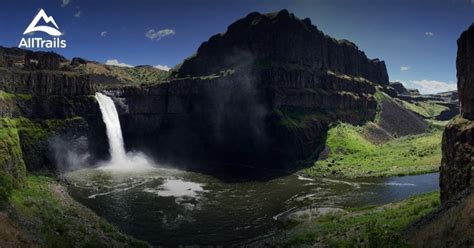 an image of a waterfall in the middle of some mountains with water ...