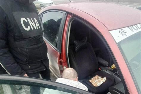 Un polițist reținut în flagrant de CNA și procurorii anticorupție