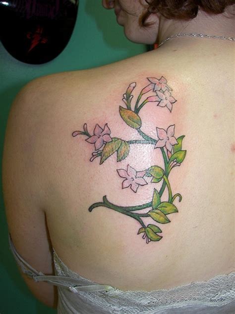 Interesting designed jasmine flower tattoo on back - Tattooimages.biz