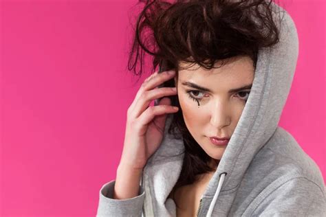 Woman Portrait With Messy Hair And Black Tears Wearing Hoodie Stock