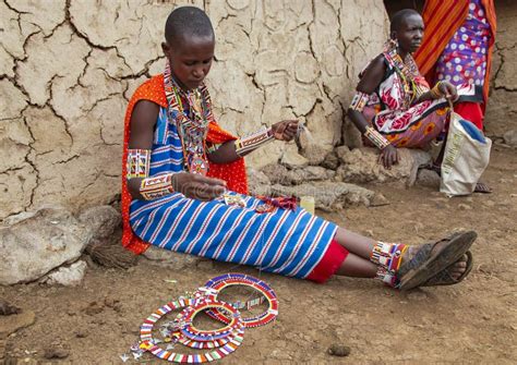 Portrait of a Woman of the Maasai Mara Tribe in Traditional Dress ...