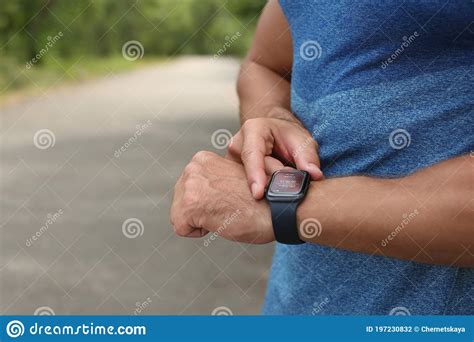 Man With Smart Watch Checking Time Interval Distance Heart Rate And