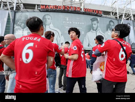 Manchester United fans stand outside Old Trafford before the Premier ...