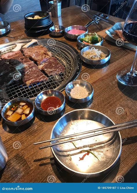 Side Dishes and Meats at Korean BBQ Restaurant Stock Image - Image of ...