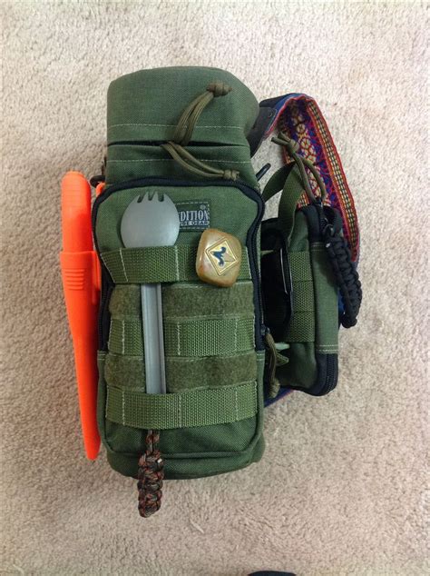 The Contents Of A Backpack Are Laid Out On The Floor