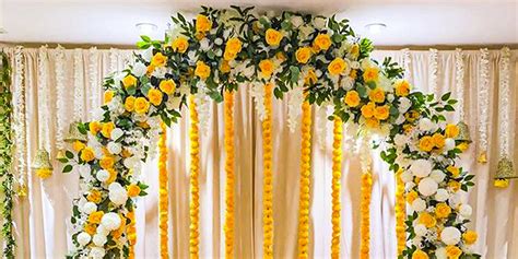 Yellow White Floral Haldi Setup Party Decorations In Delhi Ncr