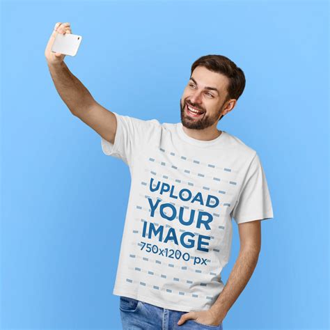 Placeit T Shirt Mockup Of A Cheerful Bearded Man Taking A Selfie In A