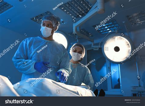 Team Professional Doctors Performing Operation Surgery Stock Photo