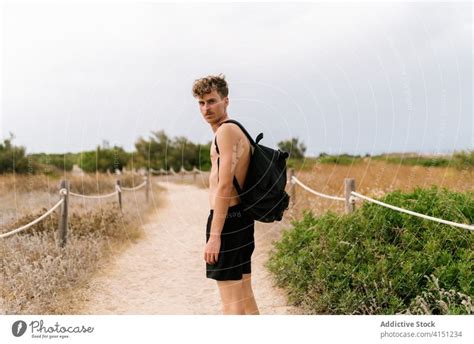 Shirtless Ethnic Man Standing In Jungle A Royalty Free Stock Photo