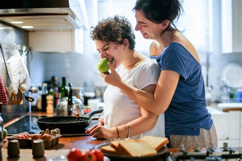 Premium Photo Lesbian Couple Cooking In The Kitchen Together