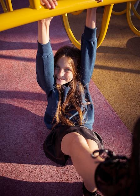 Free Photo Smiley Girl Having Fun At The Playground Outside