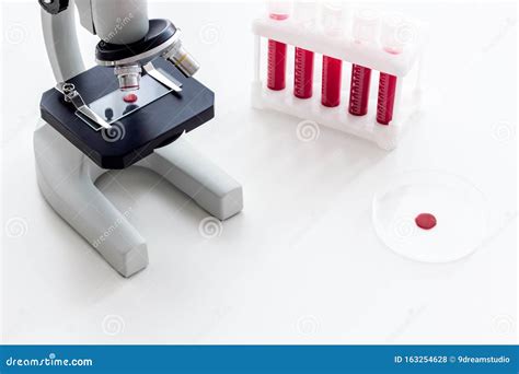 Blood Testing Laboratory Samples Viewing Under Microscope Near Tubes