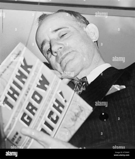 Napoleon Hill holding book 1937 Stock Photo - Alamy