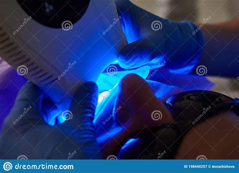 Close Up Portrait Of A Female Patient At Dentist In The Clinic Tooth