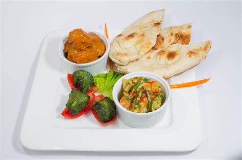 Premium Photo Chicken Harialy Kabab Chicken Tikka Masala Curry And Mix Vegetable Plain Nan And