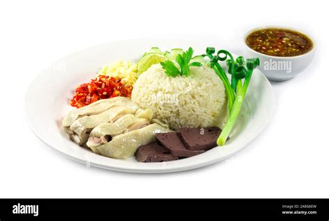 Hainanese Chicken Rice Steamed With Soya Sauce Chopped Chili And Garlic Decorate Cucumber