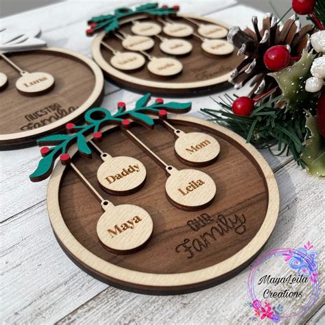 Three Wooden Christmas Ornaments With Names On Them