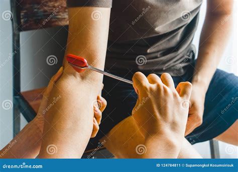 Doctor Testing Biceps Tendon Reflex Stock Image Image Of Asian