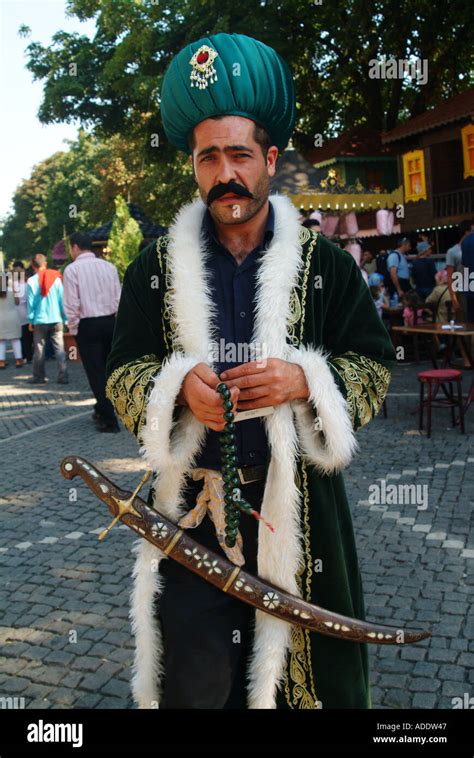 Turkish Man In Traditional Ottoman Costume In The Touristic District