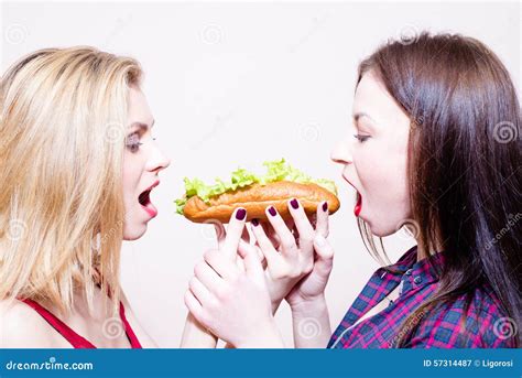 Picture Of 2 Hungry Beautiful Girls Having Fun Stock Image Image Of Food Hand 57314487