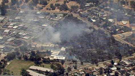 Bushfire forces evacuation of Perth school as city braces for week of scorching weather | 7NEWS